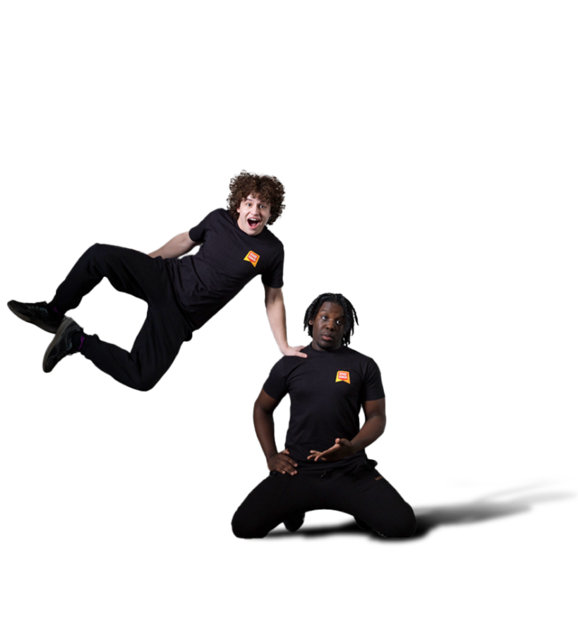 Two Stagecoach students dancing in black performing arts class uniforms.