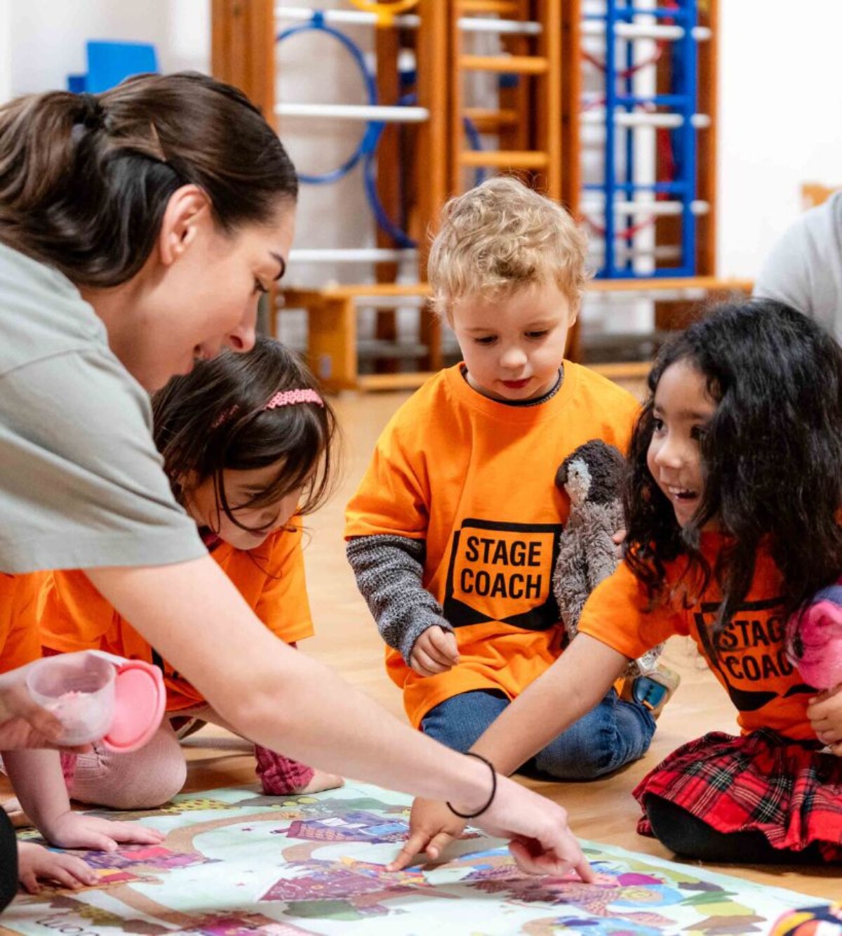Young Stagecoach students taking part in a fun singing, dancing and acting class.