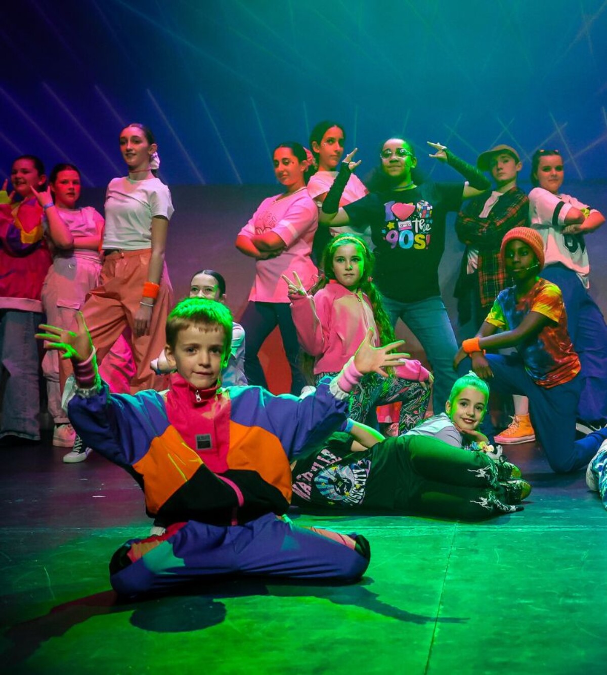 Children performing together on stage during a Stagecoach day camp.