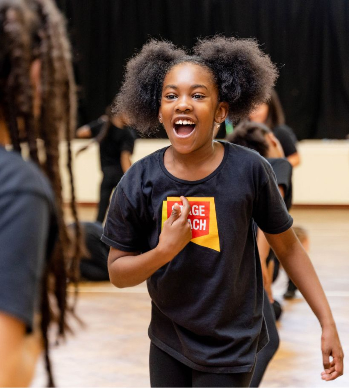 Stagecoach student building confidence and creativity through singing, dancing and acting.